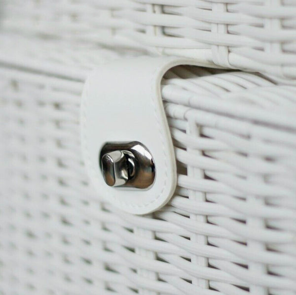 Close-up of a white woven basket with a metal clasp.