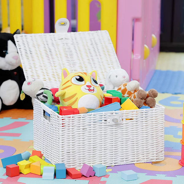 White wicker toy basket filled with colorful toys on a play mat with a colorful playpen in the background.