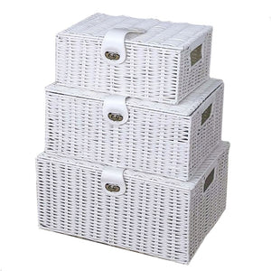 Set of three white wicker storage baskets with lids on a white background