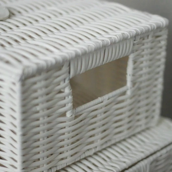 White wicker basket with a lid on a neutral background