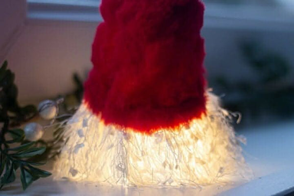 Plush gonk displayed on festive table