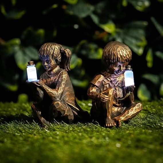 Solar powered boy and girl lantern garden ornaments