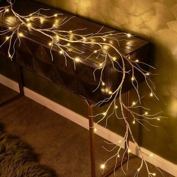 Decorative birch twigs glowing in an indoor display