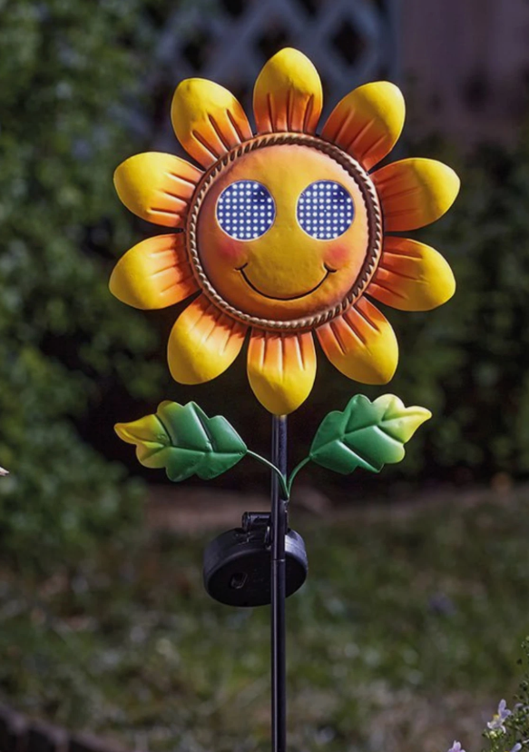 Resin sunflower ornament illuminated after dark