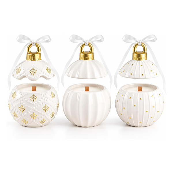 Three white ceramic Christmas ornament candle holders with gold accents and white ribbon bows, shown on a clean white background.