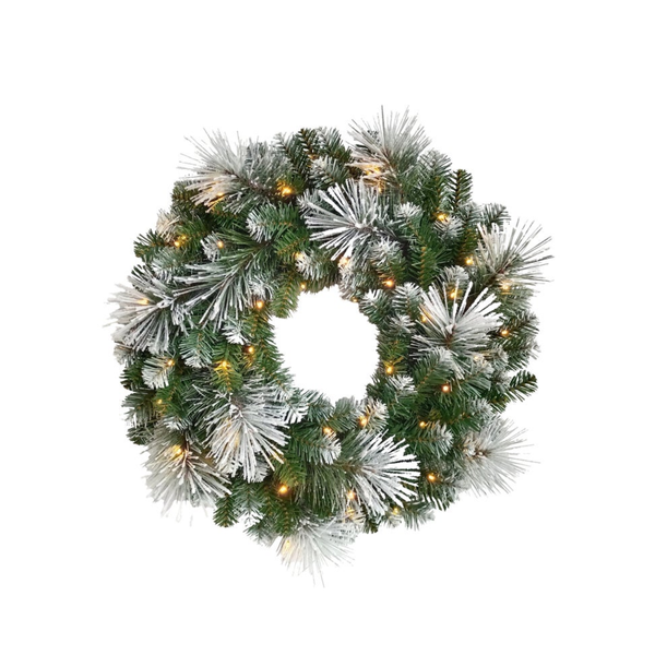 A circular artificial Christmas wreath with frosted white pine branches and warm white string lights, shown against a plain white background.