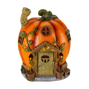 A decorative pumpkin shaped house on a white background