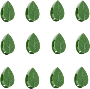 A collection of green leaf-shaped plant support clips.