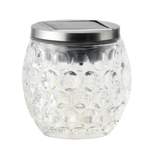 Glass jar with solar panel on top on a white background