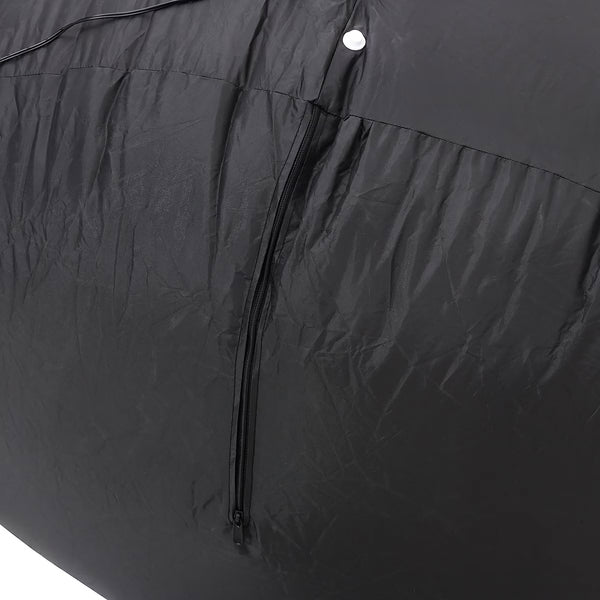 Close-up of a black waterproof fabric cover with a central zipper and a white snap button, showing the textured material and folds.