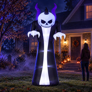 An inflatable Halloween yard decoration shaped like a skull-faced skeleton in a long black robe with purple horns, standing on a lawn in front of a house at night. A person is visible in the background near the house entrance.