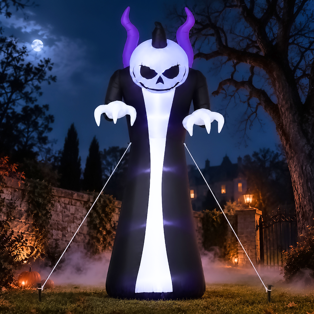 A large inflatable Halloween ghost decoration stands outdoors at night on a lawn. The ghost has a white skull face with black eyes and nose, purple horns, a black robe, glowing white body, and clawed hands.