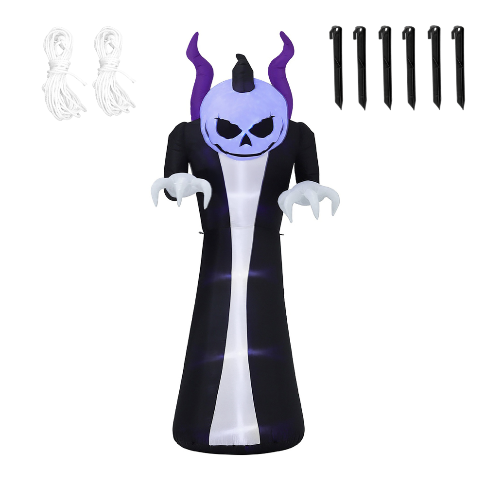 A large inflatable Halloween ghost decoration stands outdoors at night on a lawn. The ghost has a white skull face with black eyes and nose, purple horns, a black robe, glowing white body, and clawed hands.