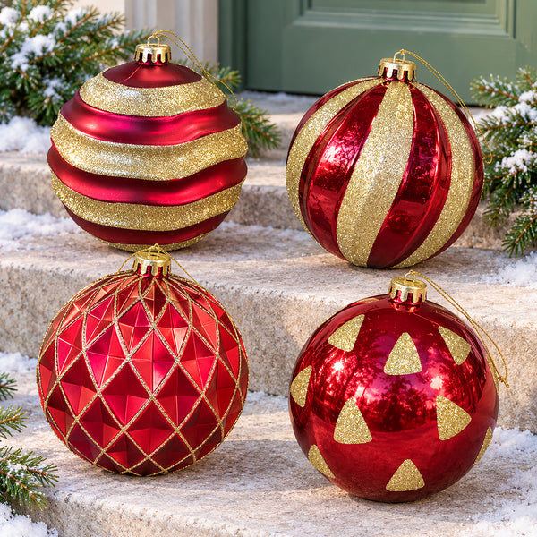 Set of four 15cm red and gold Christmas baubles arranged together with hanging cords on display.