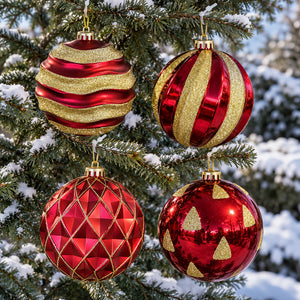 Four extra large red and gold Christmas baubles displayed together on an outdoor evergreen tree.
