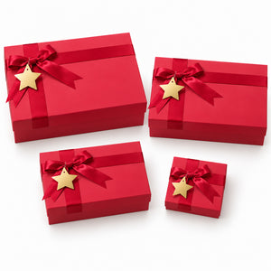 Four red gift boxes of different sizes, each tied with a red ribbon and bow and decorated with a gold star, arranged on a white background.