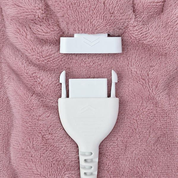 A close-up of a white plastic connector plug and matching white connector cap placed on a textured pink fabric background.