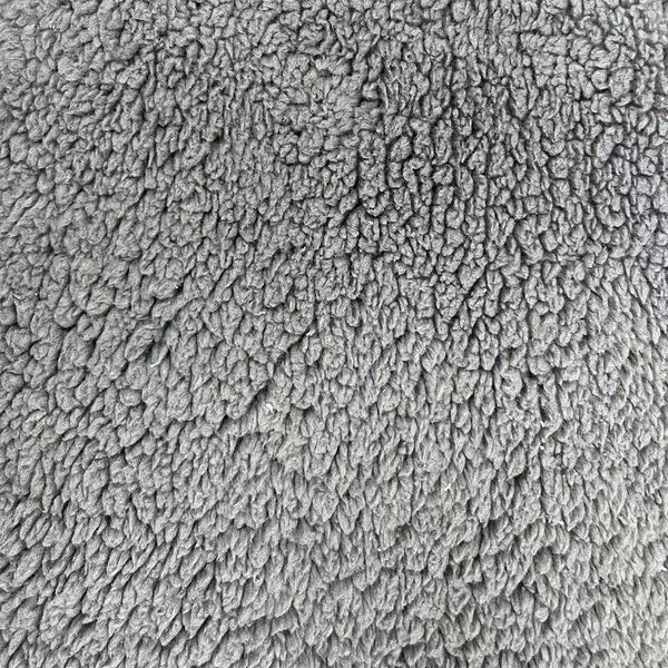 A close-up texture shot of a gray plush fleece fabric, showing the soft, looped pile detail.