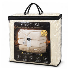 Marcu Paul heated throw blanket in its clear plastic packaging with black handles and a black front label, shown on a white background.