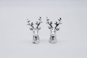 Silver deer head Salt and pepper shakres on a white background