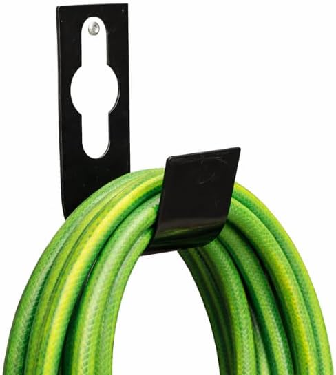 Black metal garden hose holder over outdoor tap