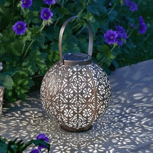 Brown Moroccan lantern displayed on an outdoor table