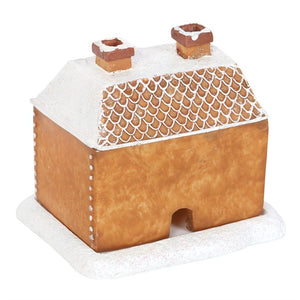 Gingerbread house with a snowy roof on a white background