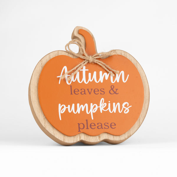 A decorative pumpkin-shaped wooden sign with an orange face, natural wood border, and twine bow, reading 'Autumn leaves & pumpkins please' on a clean white background.