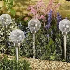 Solar colour changing crystal ball garden stake lights on pathway