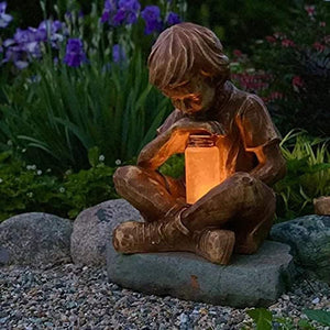Outdoor resin boy statue with light up lantern jar