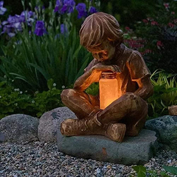 Outdoor resin boy statue with light up lantern jar