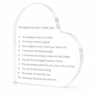 A heart-shaped clear acrylic plaque engraved with the text '10 reasons why I love you' and a numbered list of love phrases, shown on a plain white background.