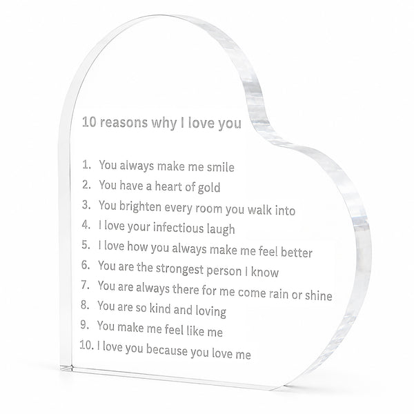 A heart-shaped clear acrylic plaque engraved with the text '10 reasons why I love you' and a numbered list of love phrases, shown on a plain white background.