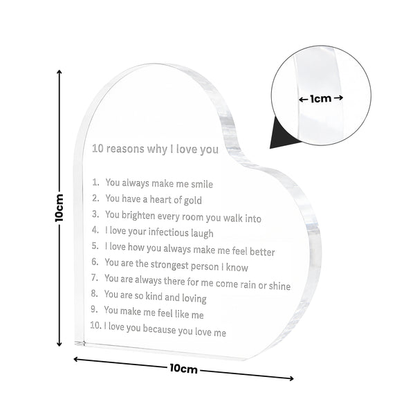 A heart-shaped clear acrylic plaque engraved with '10 reasons why I love you' and dimensions shown on a white background, including a circular inset highlighting a 1cm edge detail.