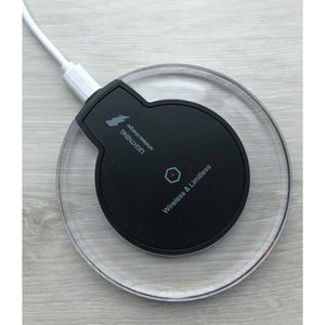 Qi compatible smartphone placed on black charger