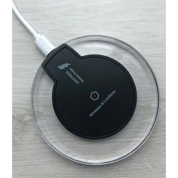 Qi compatible smartphone placed on black charger