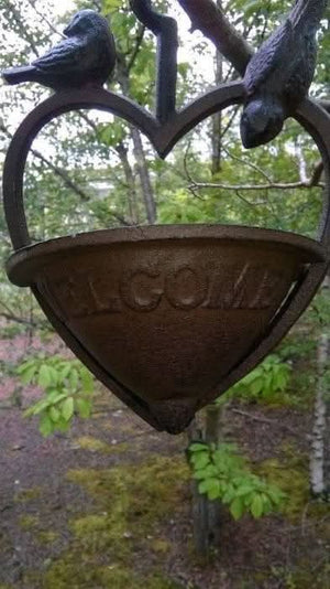 Rustic cast iron bird bath feeder for cottage gardens