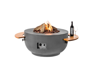 Gray fire pit table with flames, a bottle, and a glass on a white background