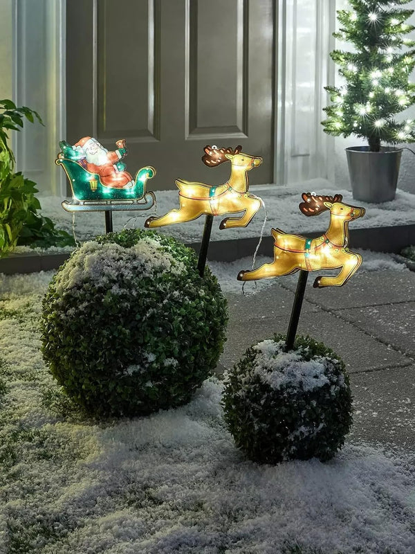 Illuminated Santa sleigh with decorative reindeer figures