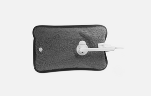 Gray heating pad with white plug on a white background