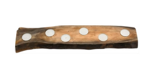 Wooden candle holder with six white candles on a white background