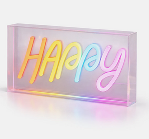 Neon sign with the word 'Happy' in rainbow colors on a white background