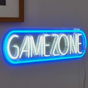 Neon sign with 'GAMEZONE' text on a white wall