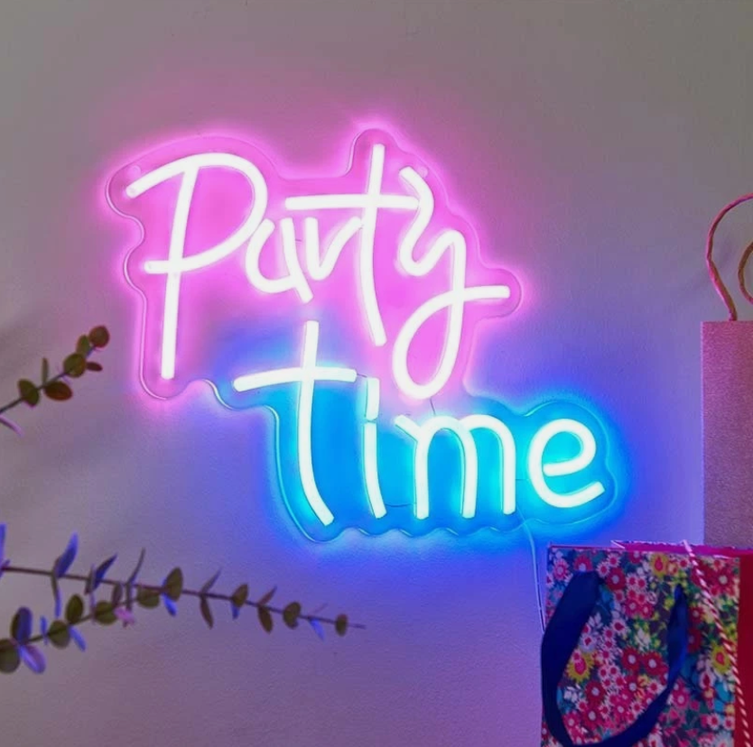 Outdoor patio with 'Party Time' neon sign, drinks, and string lights.