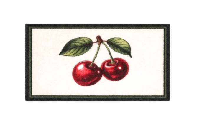 Decorative doormat with cherries on a wooden floor