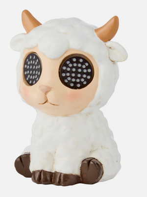 Toy figure of a white lamb with brown horns and hooves on a white background