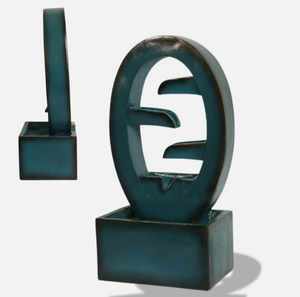 Abstract sculpture with a geometric design on a white background