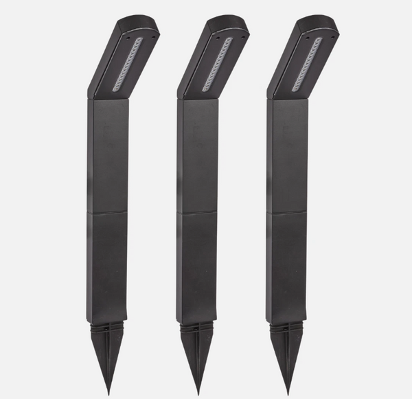 Three black garden tools with pointed ends on a white background