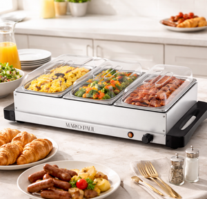 Hot food display case with various food items on a kitchen counter.