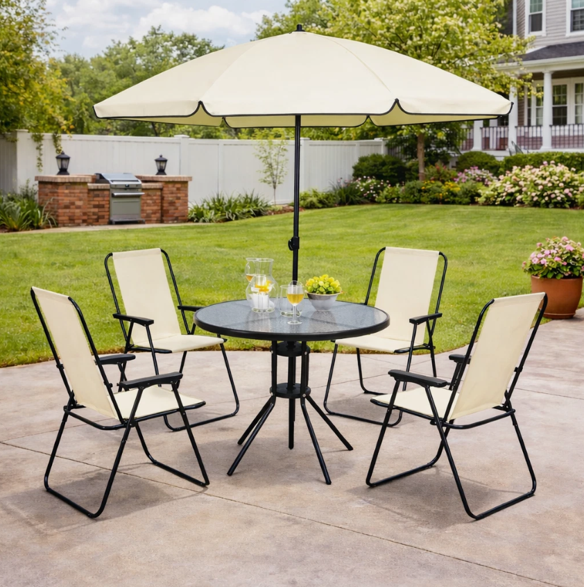 Outdoor patio set with table, chairs, and umbrella on a patio